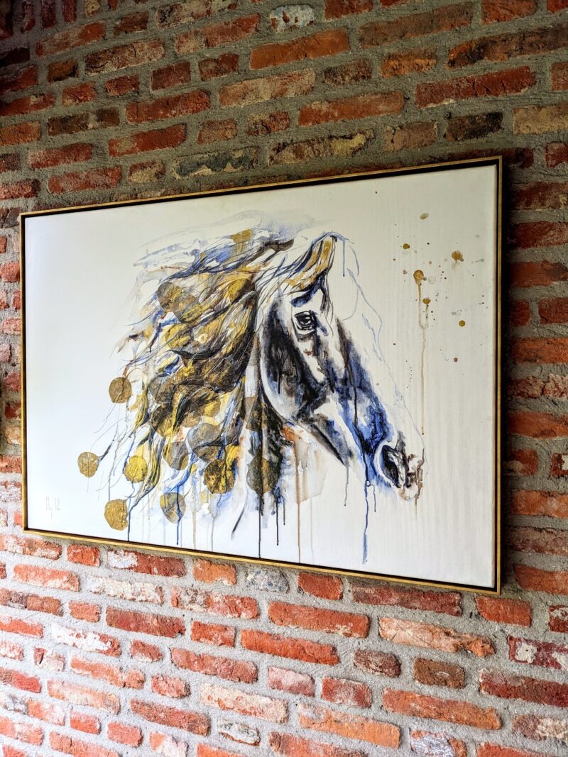 Horse painting with real leaves against brick wall